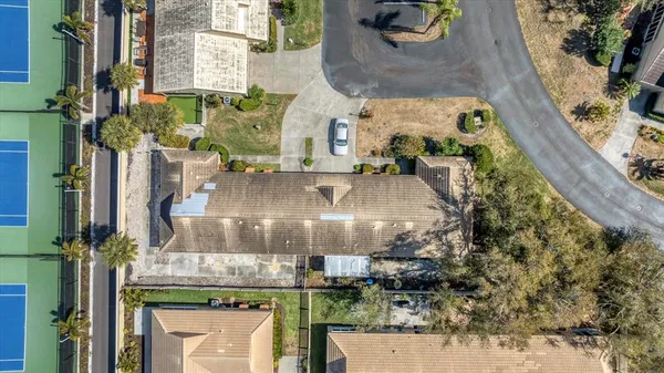an aerial view of houses with outdoor space