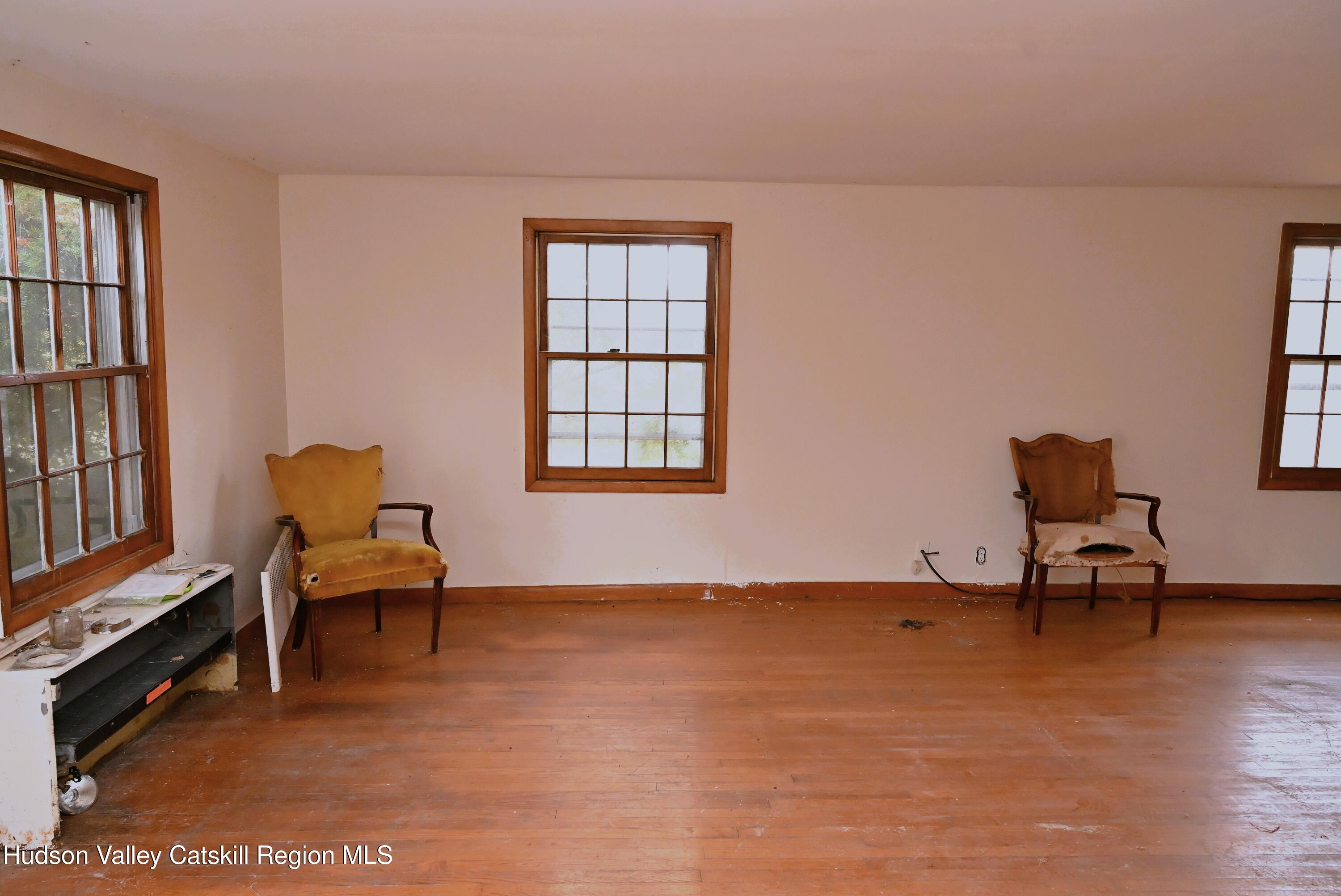 163 County Rte 14 Hudson, NY 12534 - Photo 11 of 49 a living room with furniture a piano and a window