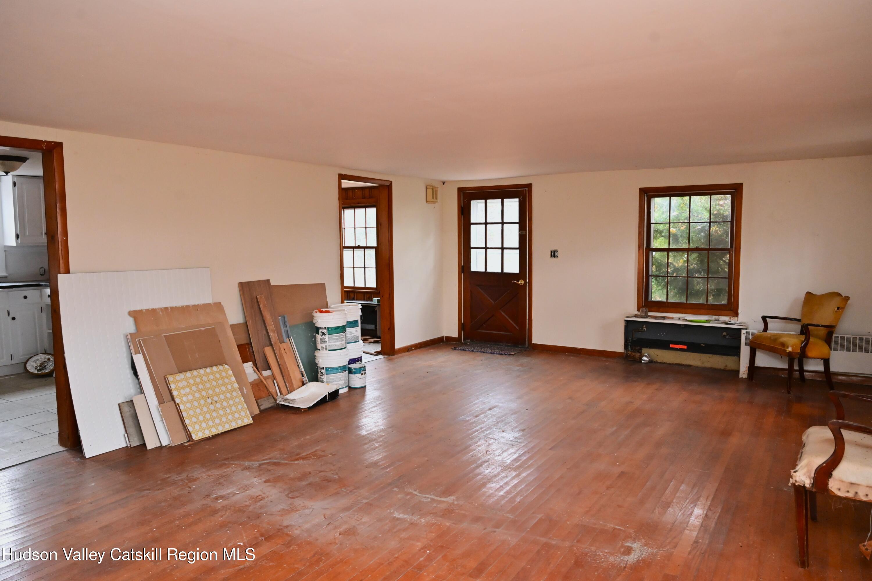 163 County Rte 14 Hudson, NY 12534 - Photo 13 of 49 a view of a livingroom with lounge chair and a window