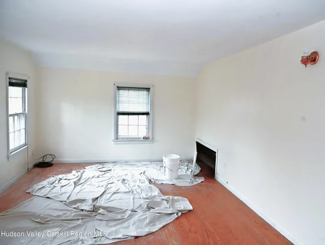 a room with a bed and a television