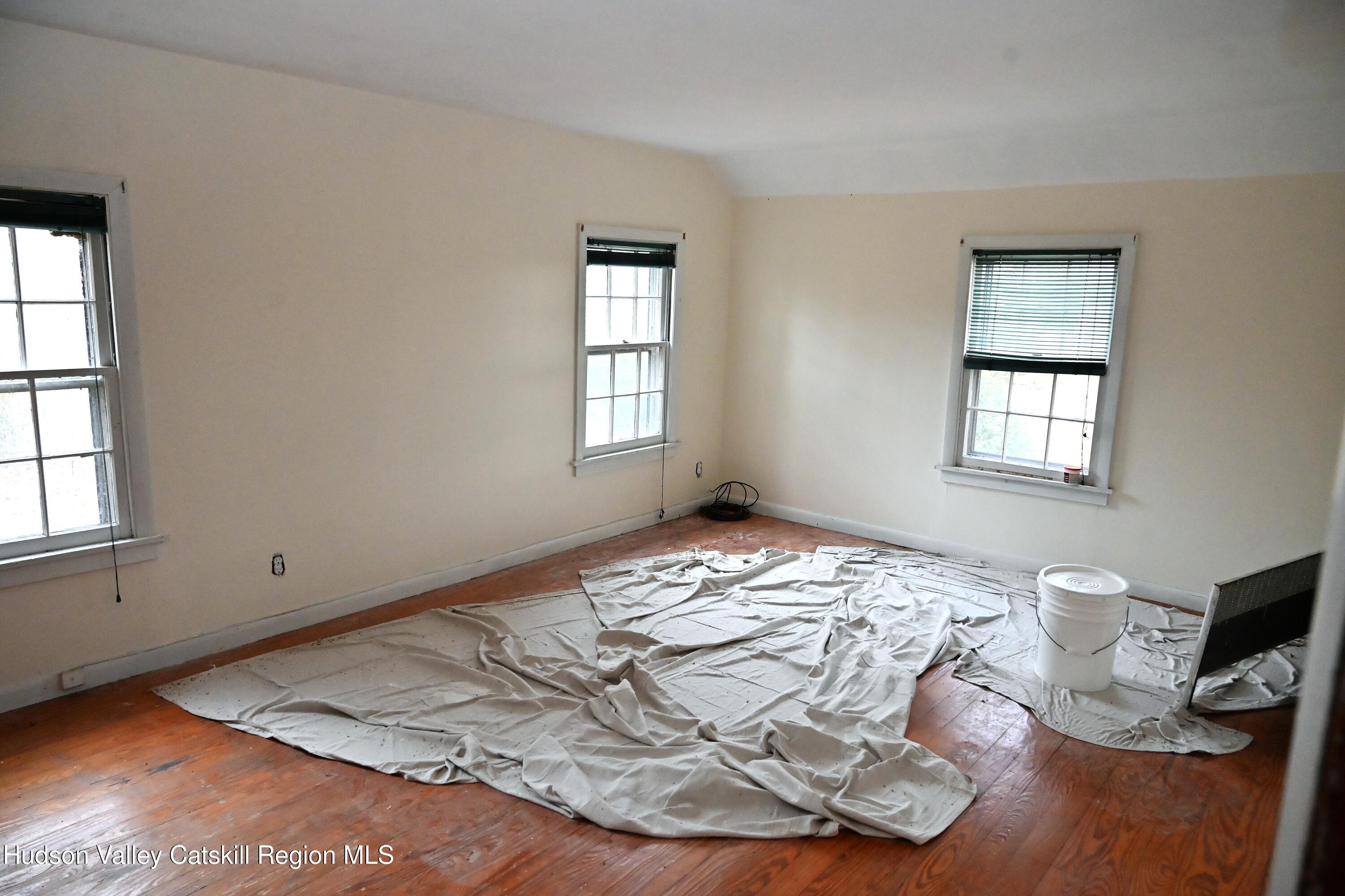 163 County Rte 14 Hudson, NY 12534 - Photo 17 of 49 a view of a livingroom with wooden floor and a window