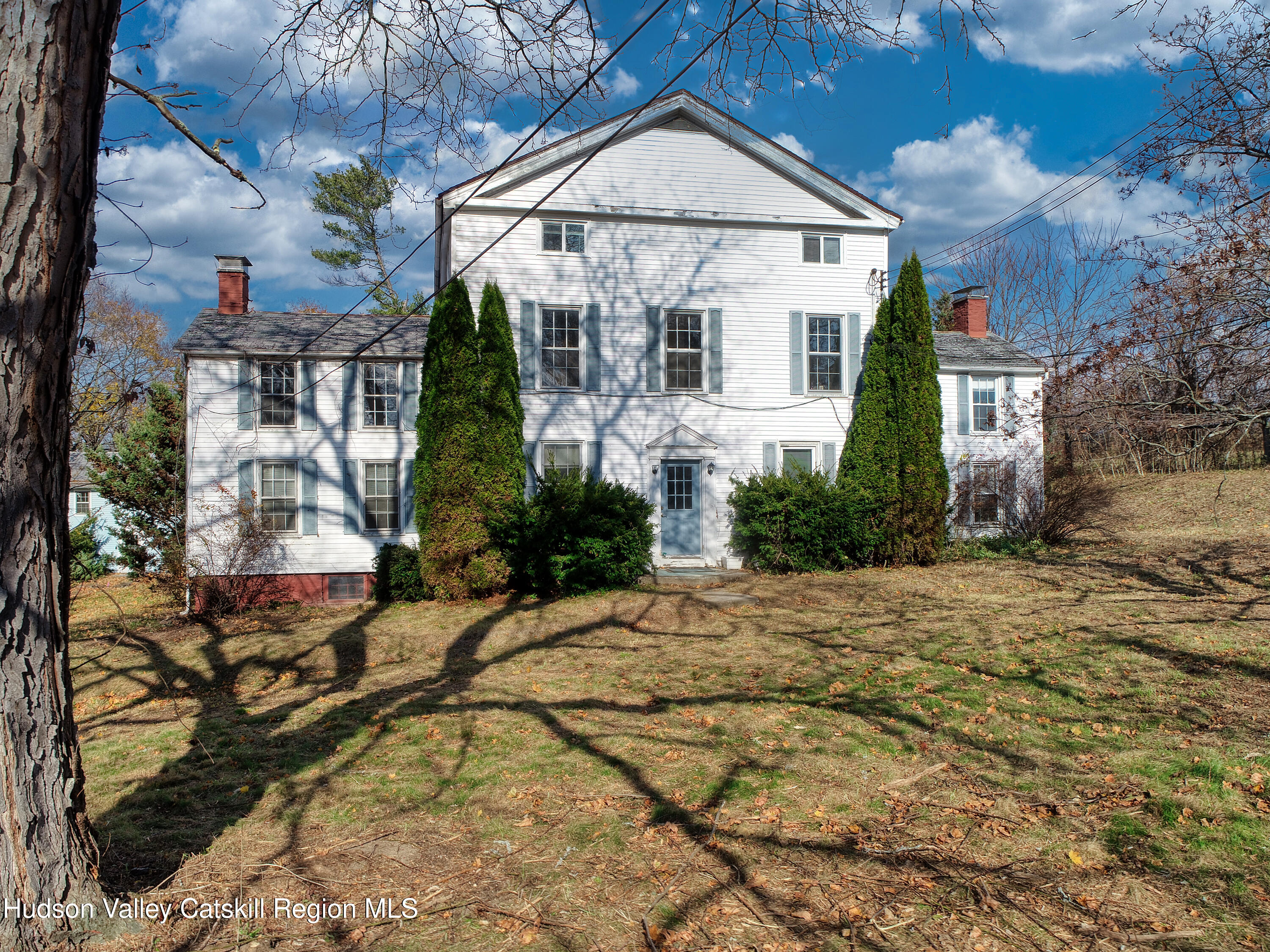 163 County Rte 14 Hudson, NY 12534 - Photo 2 of 49 a view of a big house with wooden fence