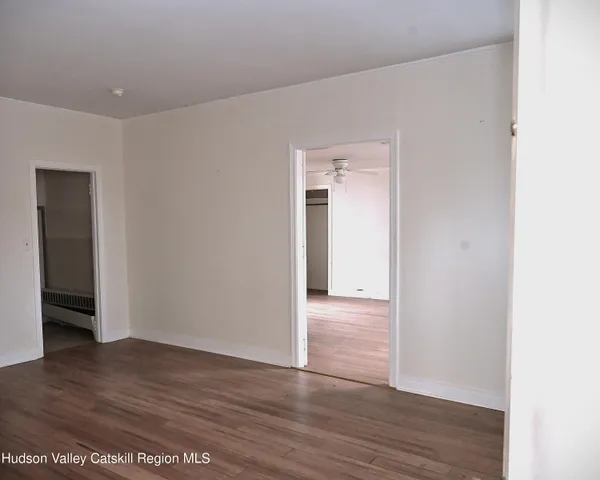 a kitchen with a sink a window and cabinets