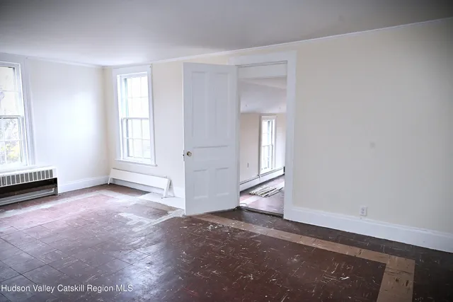 a kitchen with granite countertop a sink stove and refrigerator