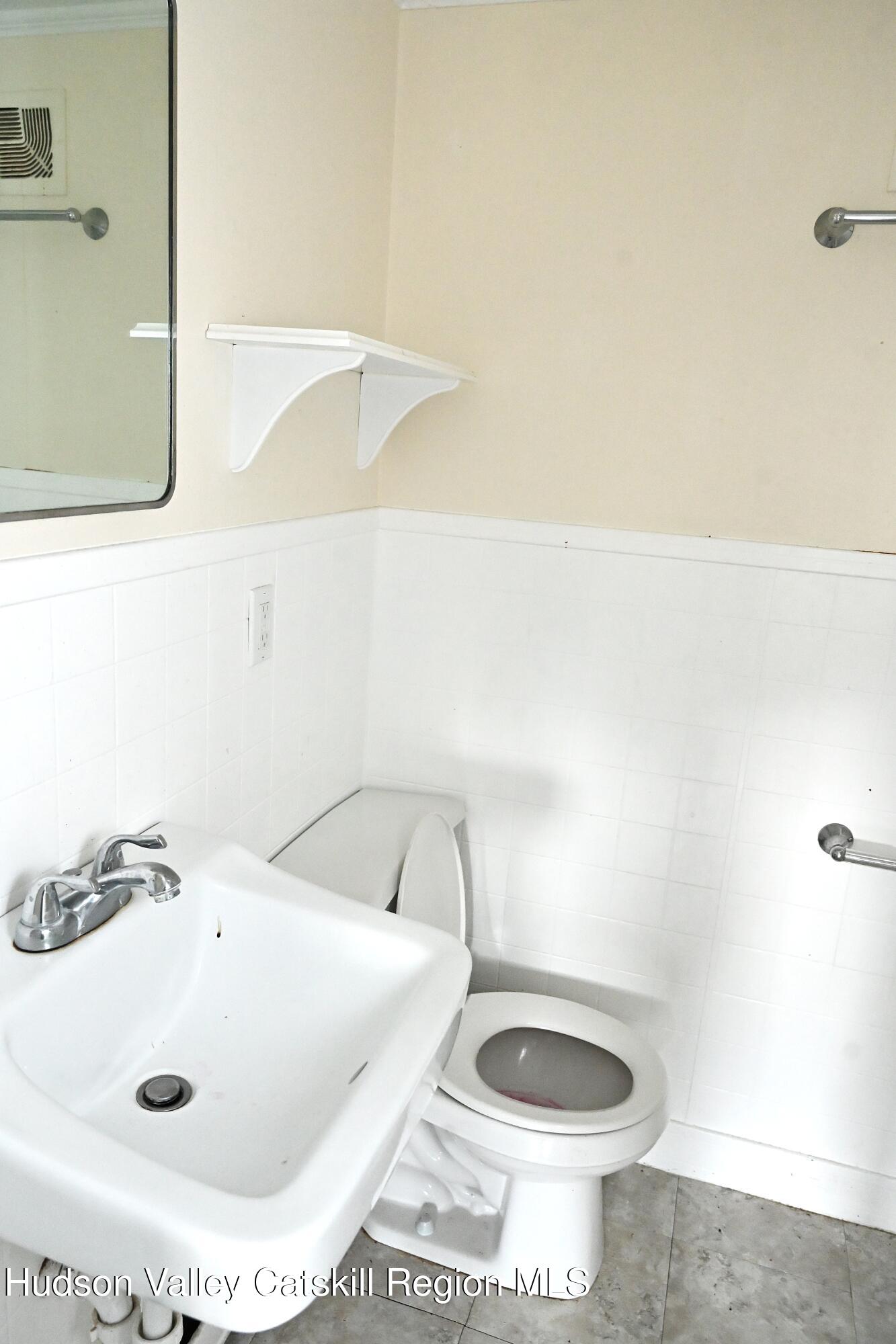 163 County Rte 14 Hudson, NY 12534 - Photo 35 of 49 a bathroom with a sink and a toilet