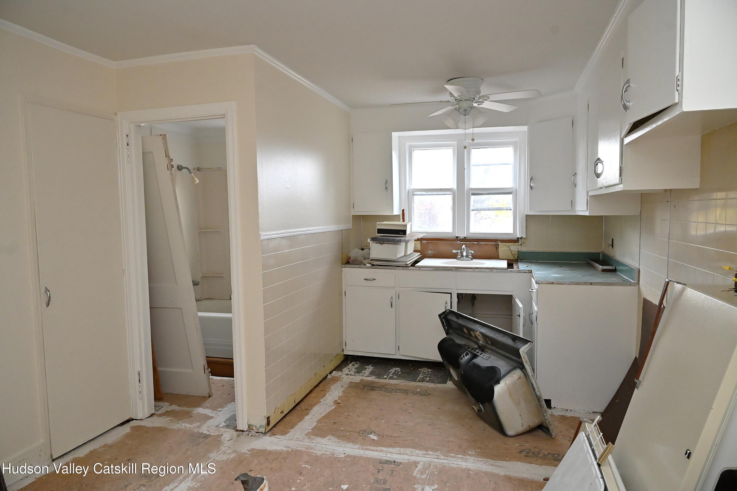 163 County Rte 14 Hudson, NY 12534 - Photo 43 of 49 a kitchen with a sink cabinets and window