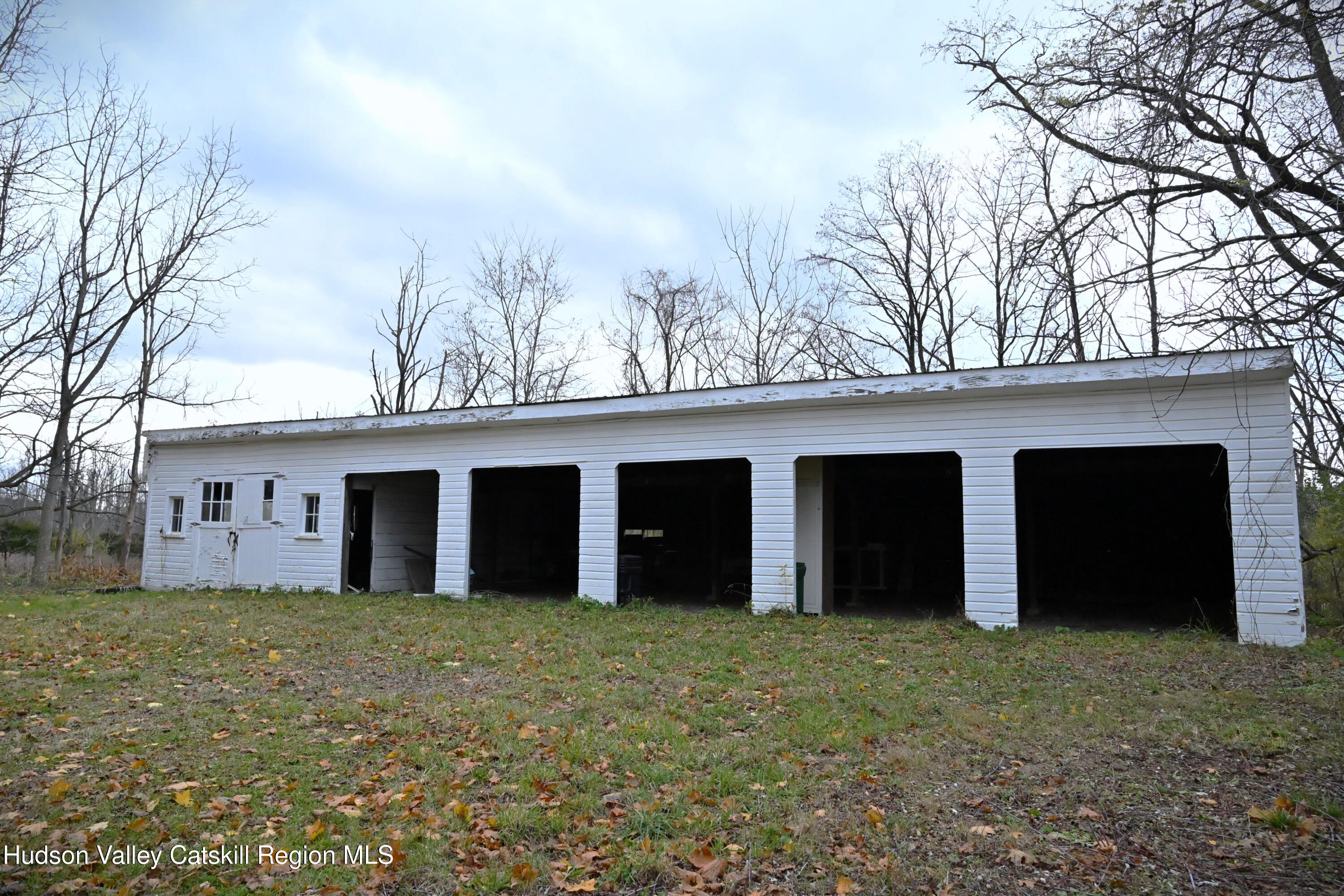 163 County Rte 14 Hudson, NY 12534 - Photo 45 of 49 front view of a house with a yard and garage