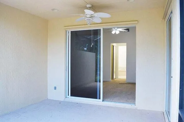 an empty room and closet with a mirror