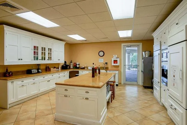 a kitchen with cabinets and a sink