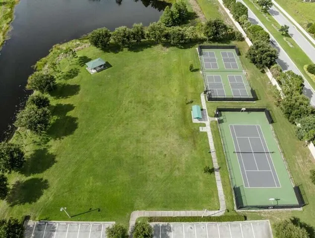 an aerial view of a residential houses with outdoor space