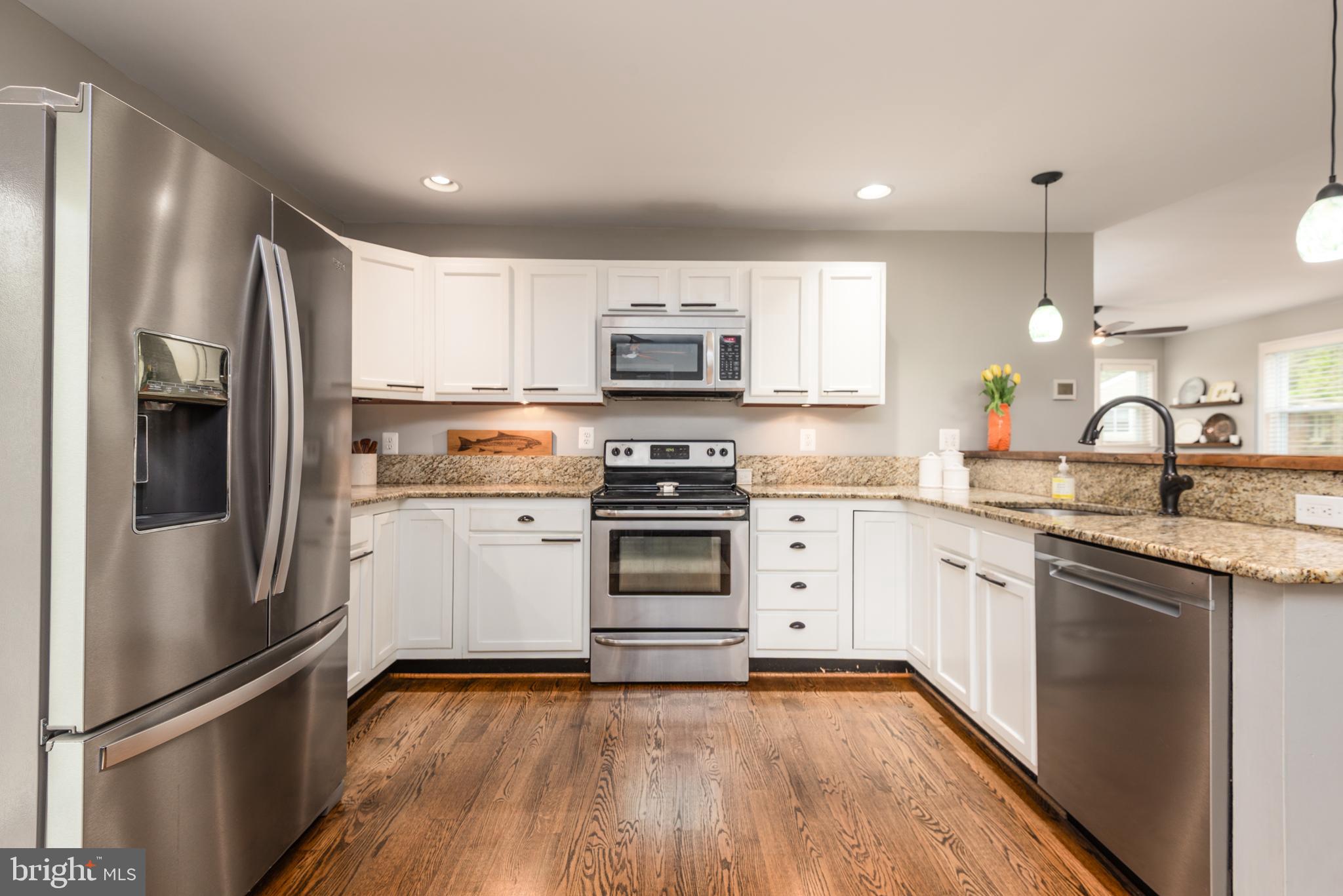 134 Cresston Road Arnold, MD 21012 - Photo 25 of 35 a kitchen with granite countertop a refrigerator stove and sink