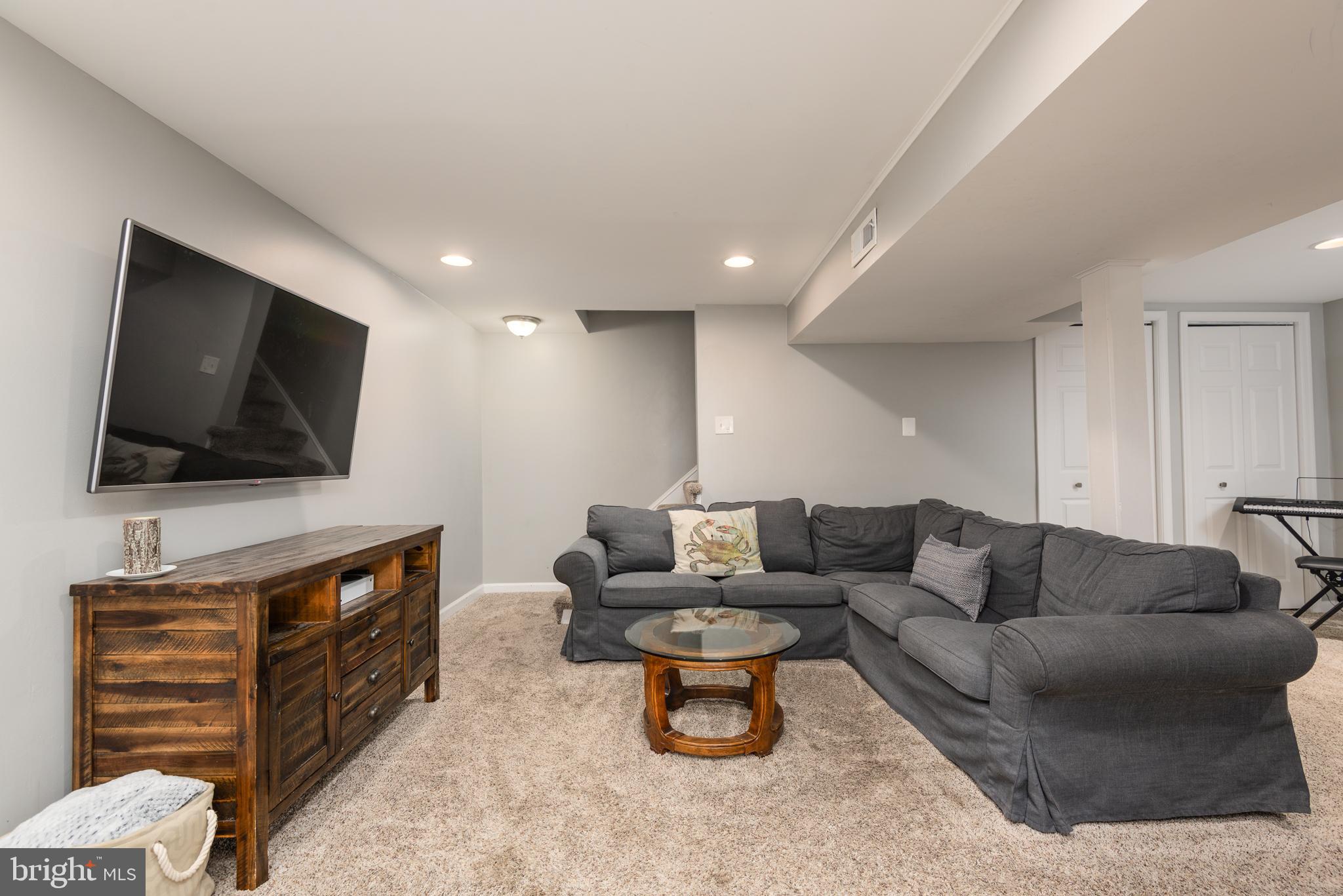134 Cresston Road Arnold, MD 21012 - Photo 31 of 35 a living room with furniture and a flat screen tv