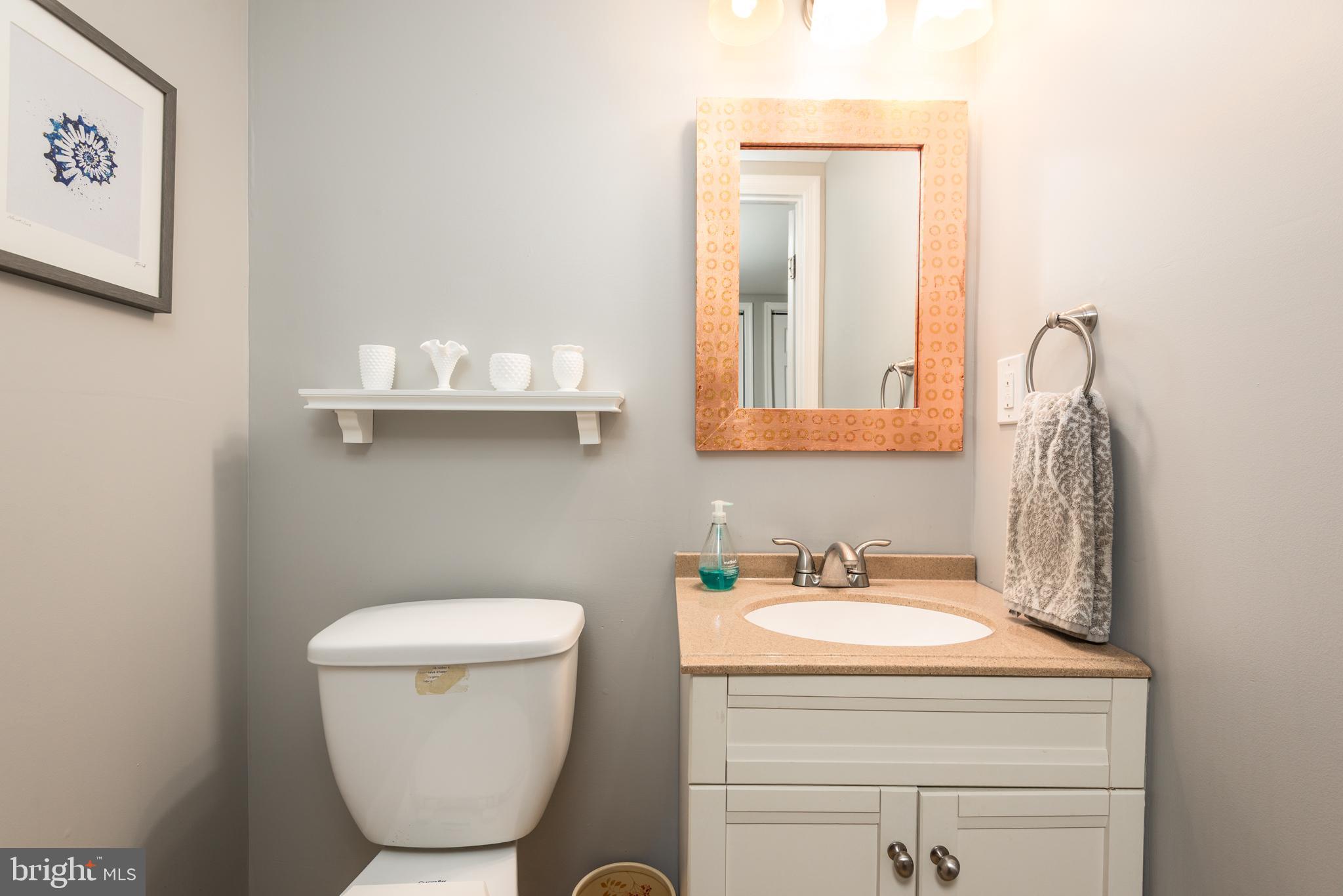 134 Cresston Road Arnold, MD 21012 - Photo 33 of 35 a bathroom with a toilet sink and mirror
