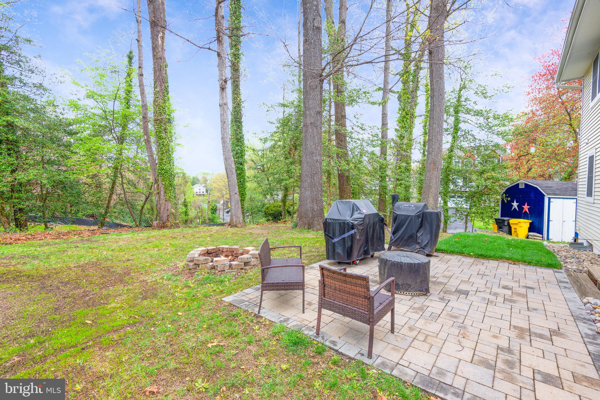 134 Cresston Road Arnold, MD 21012 - Photo 4 of 35 a view of a patio with couches and a table and chairs with wooden fence