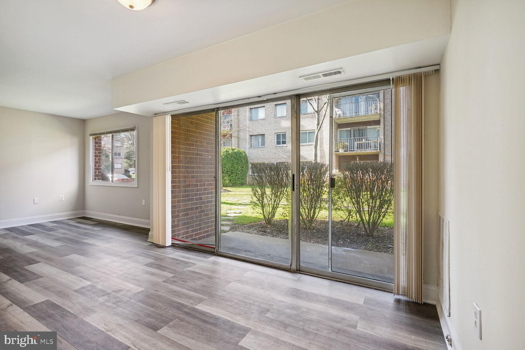 3834 Bel Pre Road, Unit 38342 Silver Spring, MD 20906 - Photo 3 of 15 Dining Room with Slider to Patio