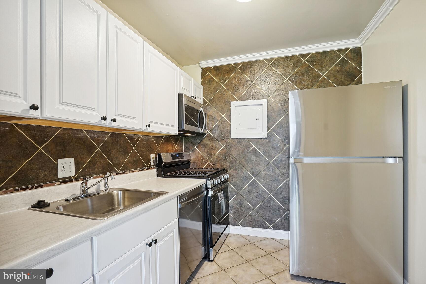 3834 Bel Pre Road, Unit 38342 Silver Spring, MD 20906 - Photo 6 of 15 Tiled Kitchen Stainless Appliances (& dishwasher)