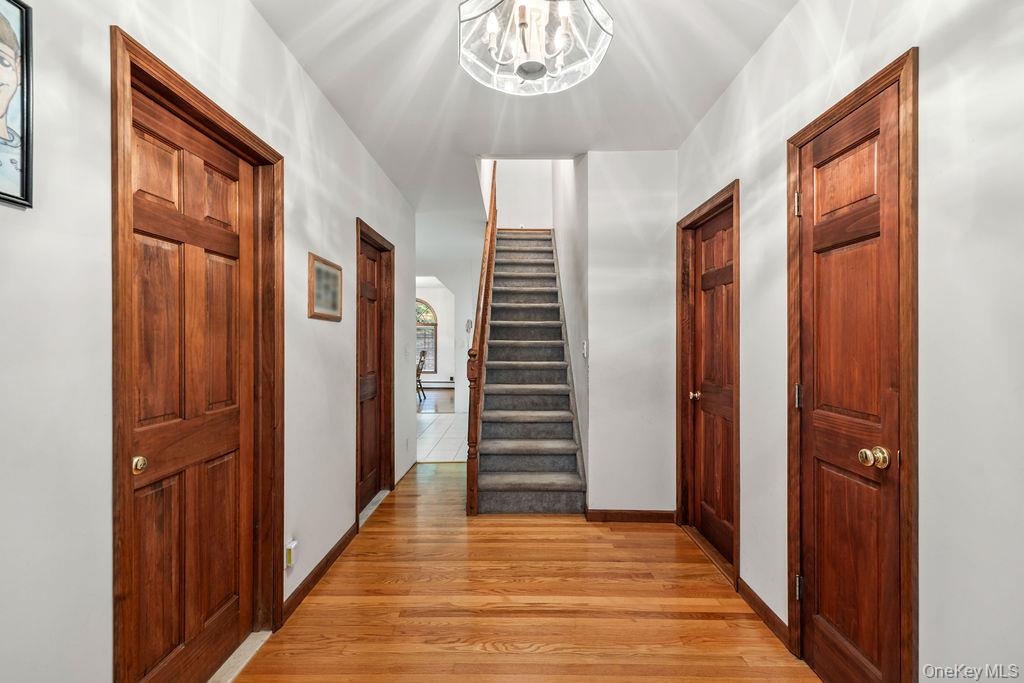 289 Seven Springs Mountain Road Monroe, NY 10950 - Photo 17 of 25 a view of a hallway with wooden floor and staircase