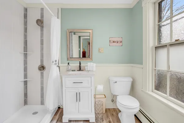 a bathroom with a sink toilet and shower