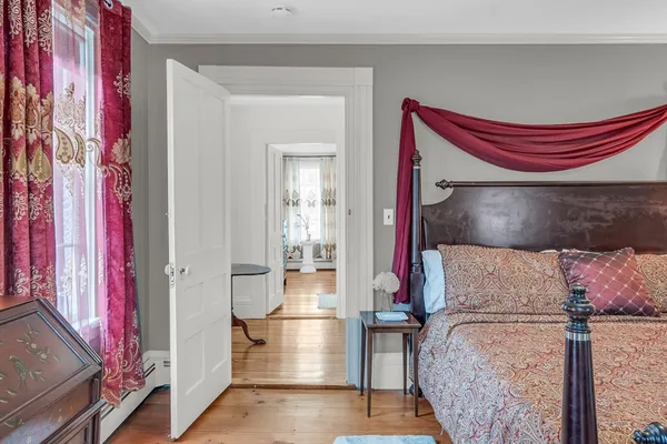 a room that has a bed and a mirror on it