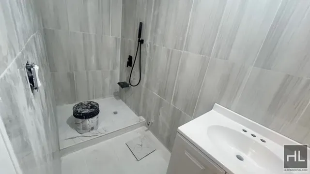a bathroom with a bathtub sink and shower curtain