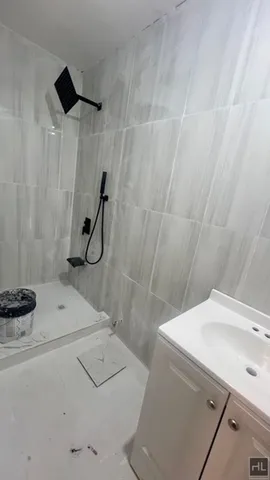 a bathroom with a sink and a shower