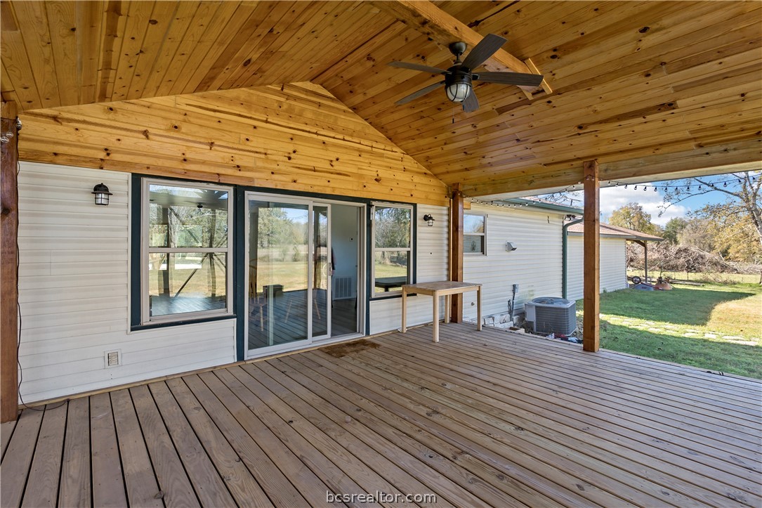 8801 Old Reliance Road Bryan, TX 77808 - Photo 22 of 24 Vaulted wood ceiling adds warmth and character to the screened outdoor living area.
