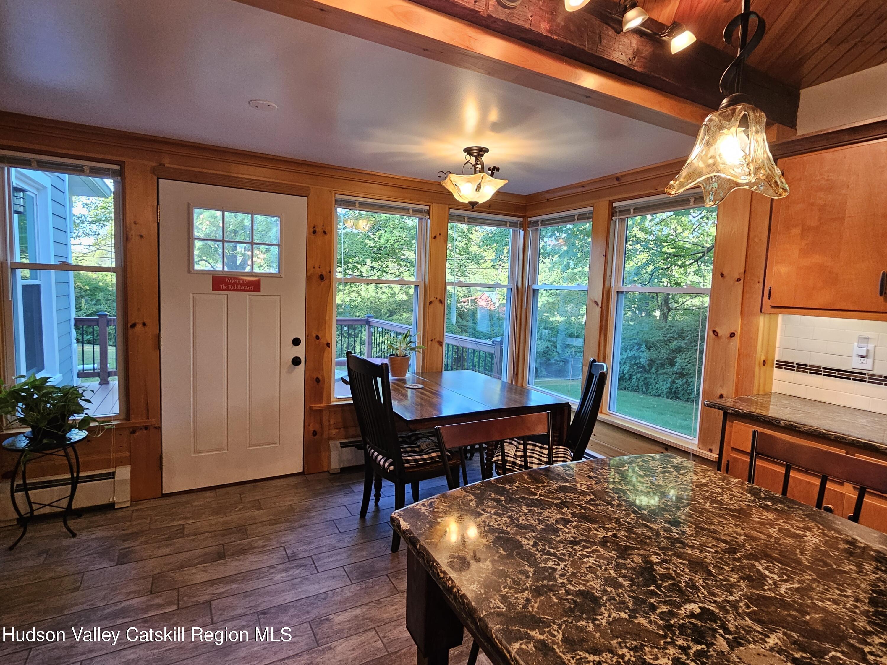 463 Cairo Junction Road Catskill, NY 12414 - Photo 12 of 35 a view of a dining room with furniture window and wooden floor