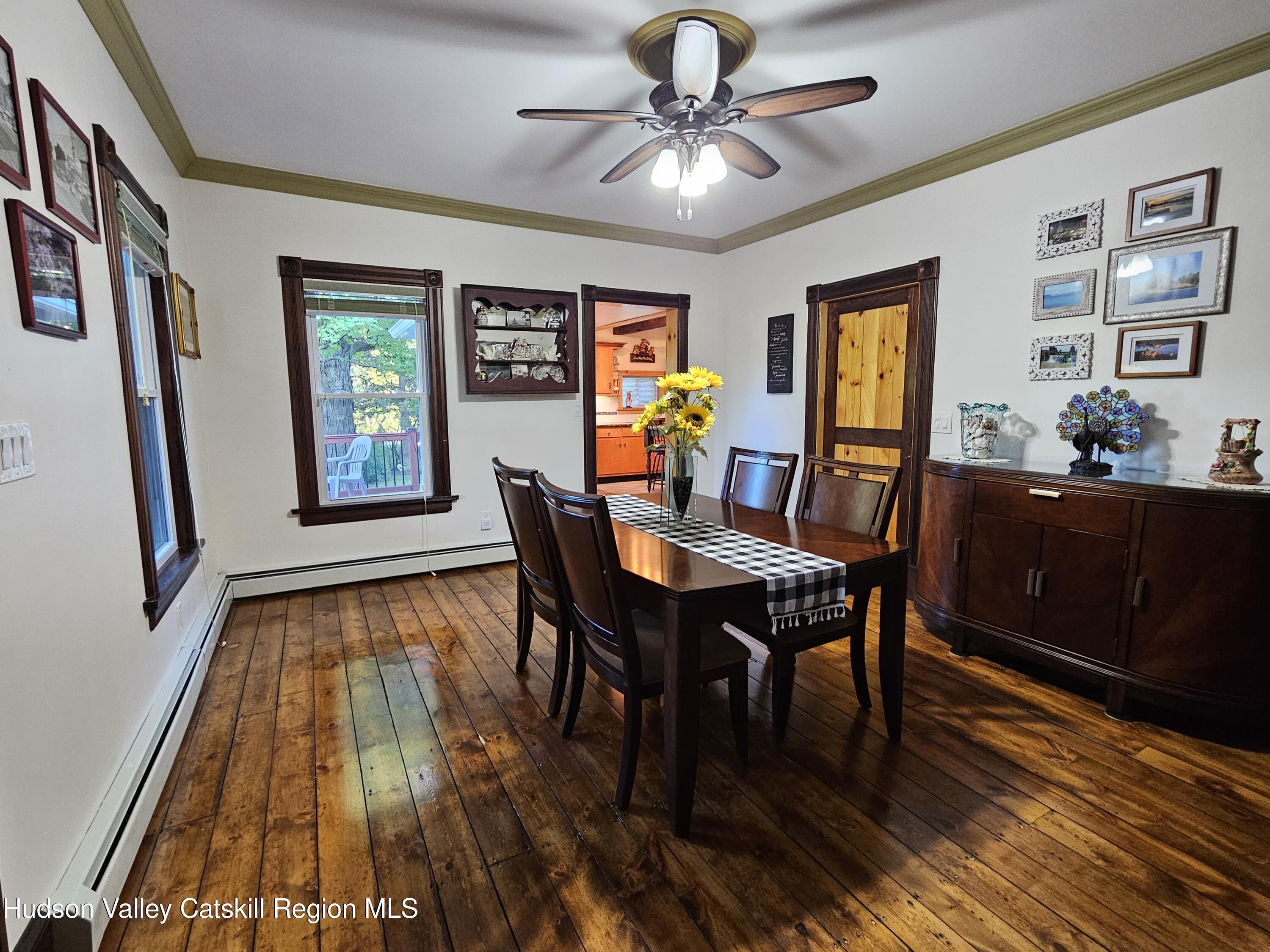 463 Cairo Junction Road Catskill, NY 12414 - Photo 15 of 35 a view of a dining room with furniture window and wooden floor