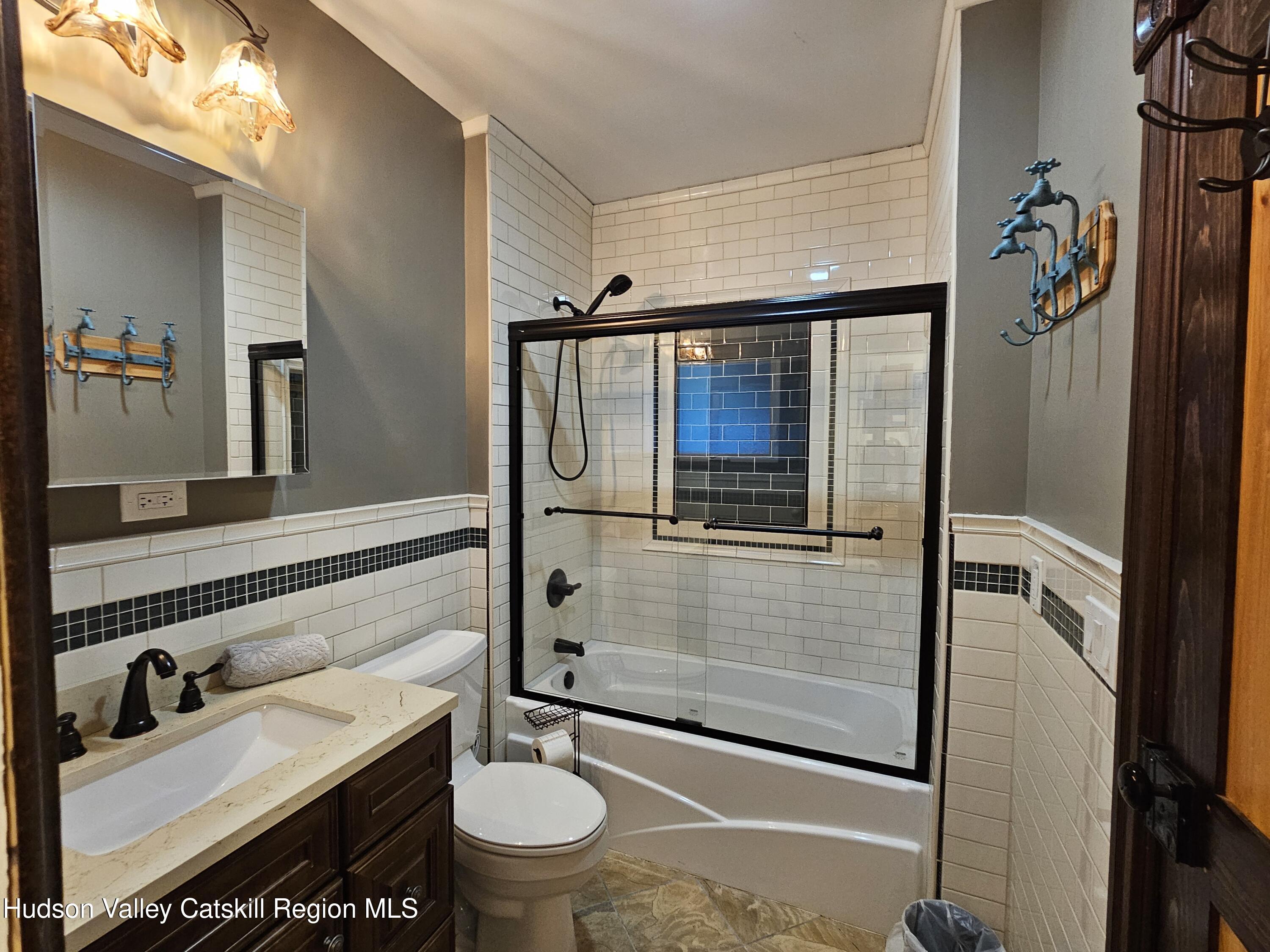 463 Cairo Junction Road Catskill, NY 12414 - Photo 19 of 35 a bathroom with a sink a toilet and shower