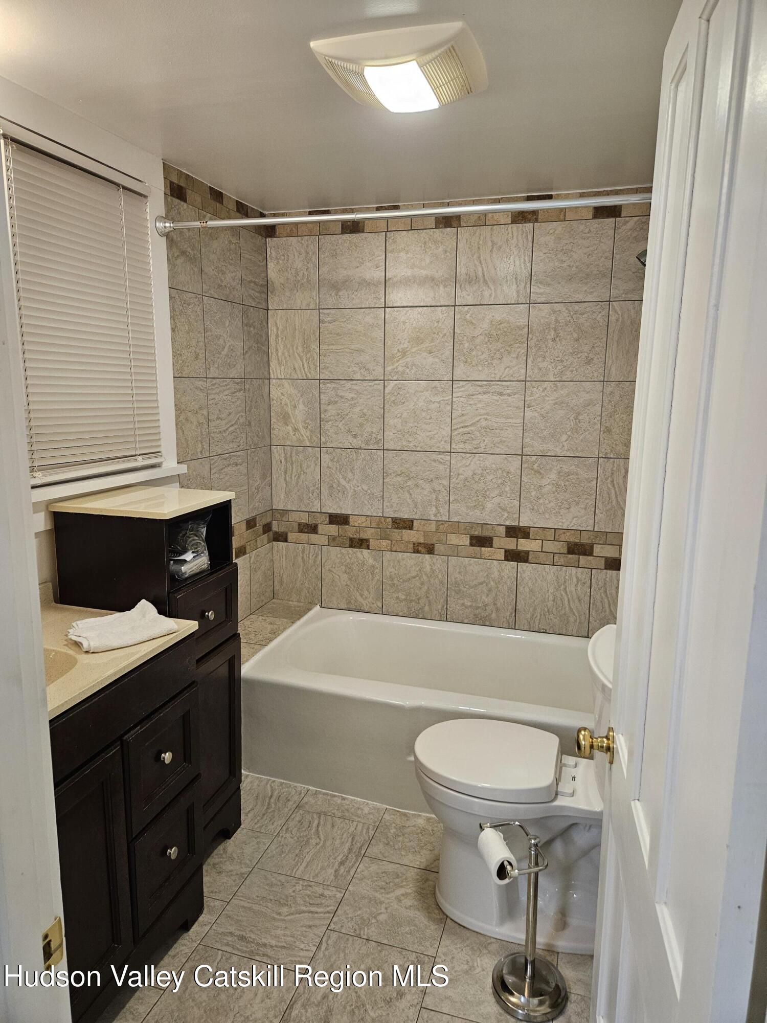 463 Cairo Junction Road Catskill, NY 12414 - Photo 29 of 35 a bathroom with a toilet a sink and bathtub