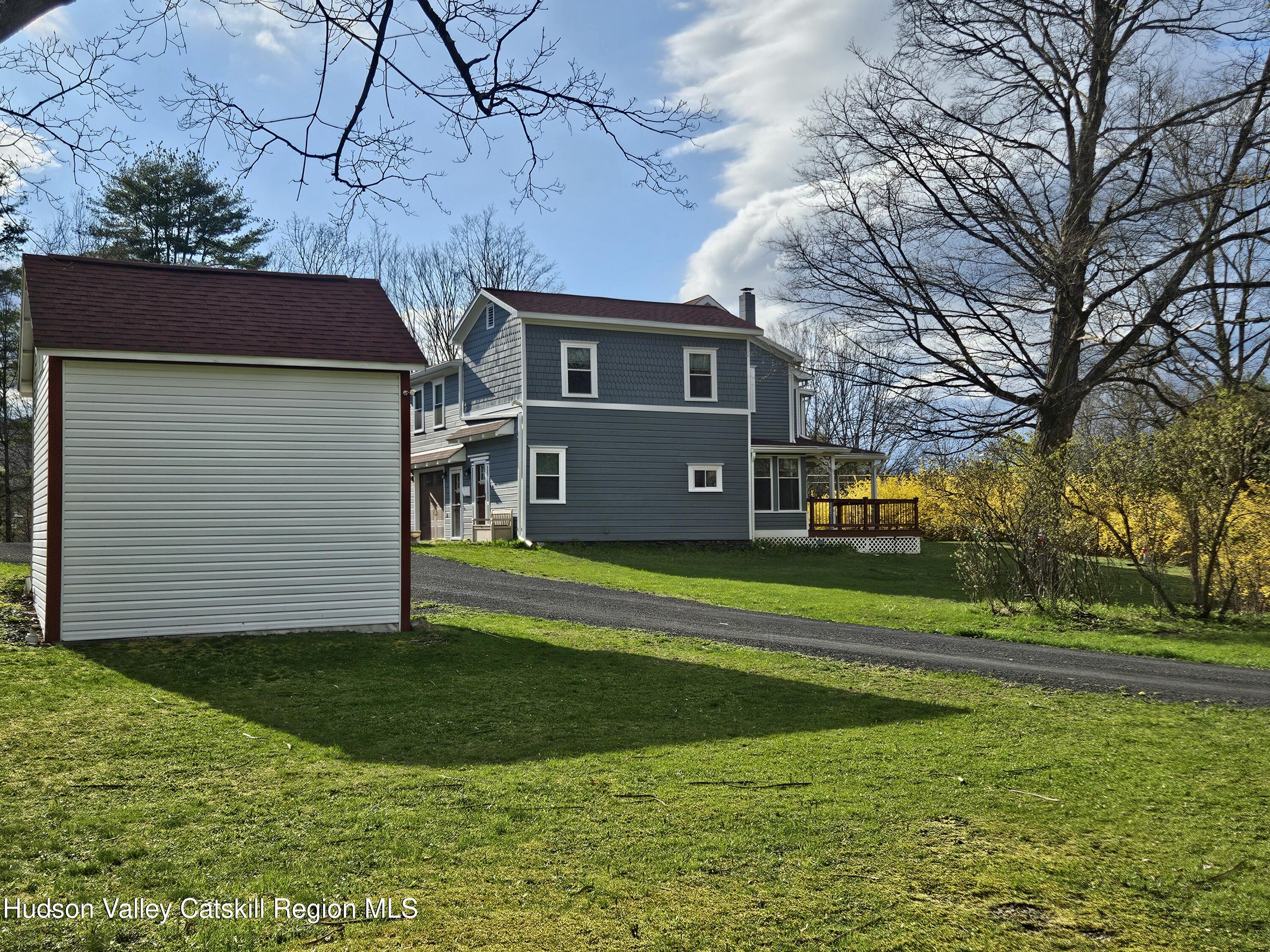 463 Cairo Junction Road Catskill, NY 12414 - Photo 31 of 35 a front view of a house with a yard and trees