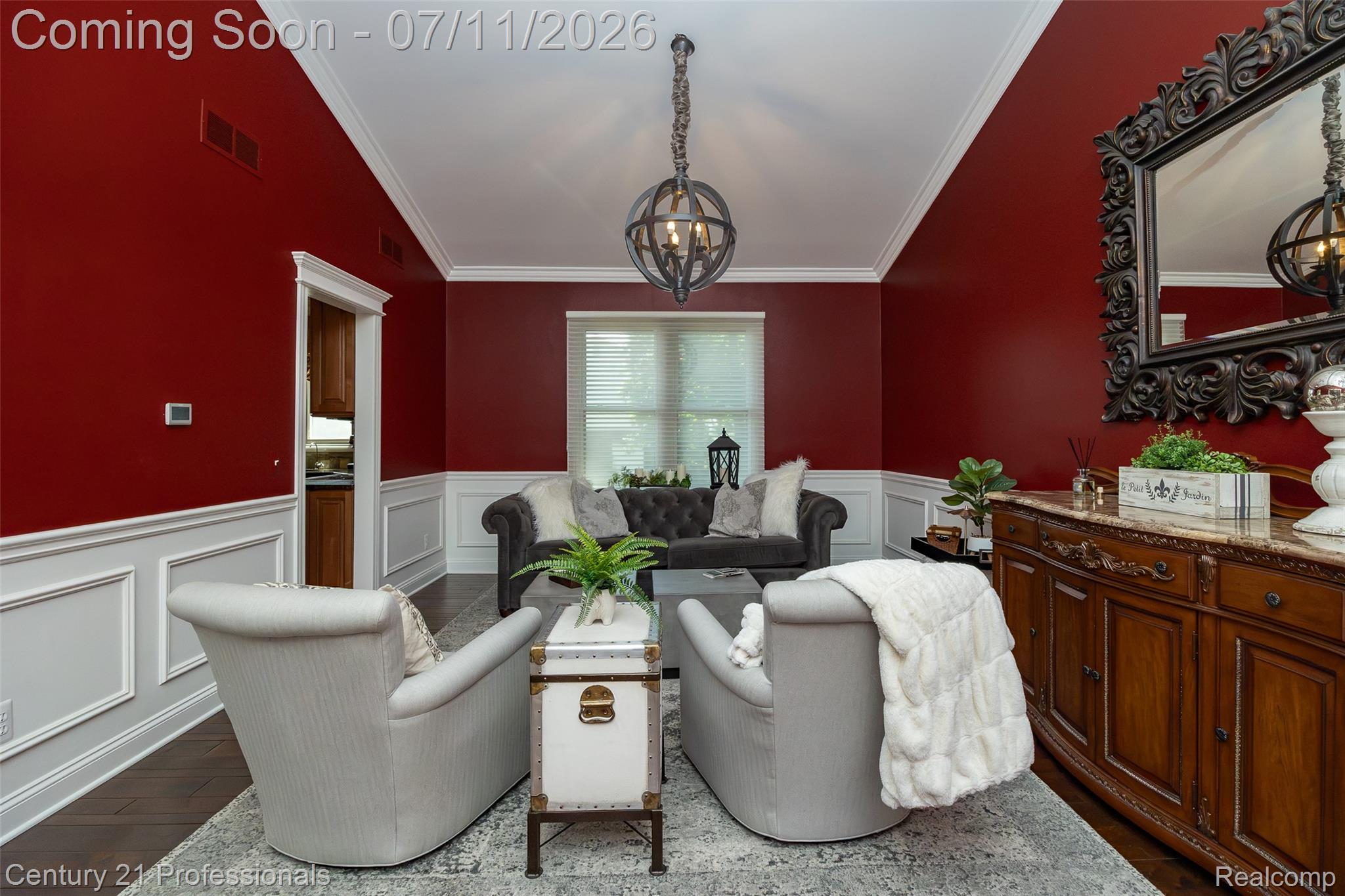 689 Woodfield Way Rochester, MI 48307 - Photo 46 of 61 Formal dining area featuring rich wall color, extensive wainscoting, crown molding, and wood-finish flooring