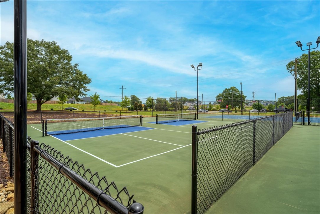 621 Wh Kay Lane Anderson, SC 29621 - Photo 49 of 50 Enjoy lively matches on well-maintained pickleball courts, complete with fencing and overhead lighting for evening play.
