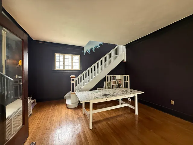 a view of a livingroom with furniture and wooden floor