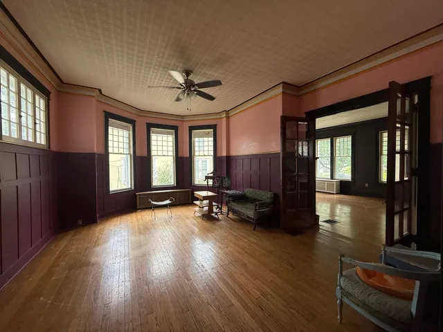 a view of livingroom with hardwood floor and a ceiling fan