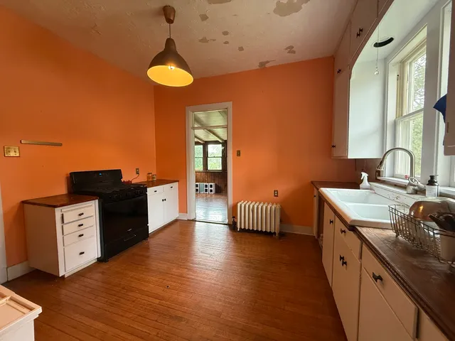 a spacious bathroom with a double vanity sink and a mirror
