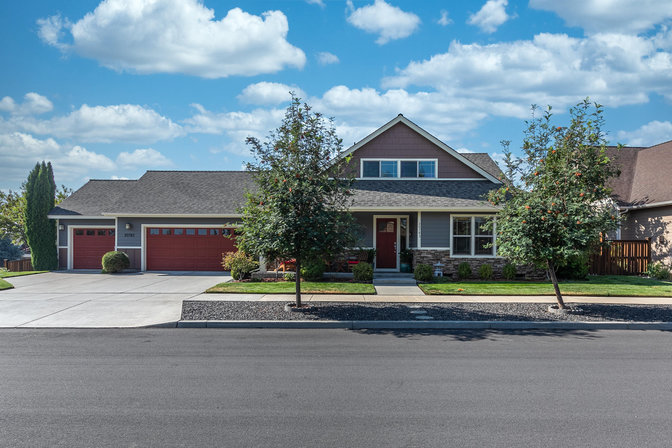 20783 Barton Crossing Way Bend, OR 97701 - Photo 30 of 37 The lush foliage of Japanese ash, aspen, and maple trees offer an eye-catching display of colors in the beautifully landscaped outdoor area that features a sprinkler system with a direct drip line for ease of maintenance. A paver stone and concrete patio provides the ideal spot to greet the day as you sip your morning coffee or read a good book.