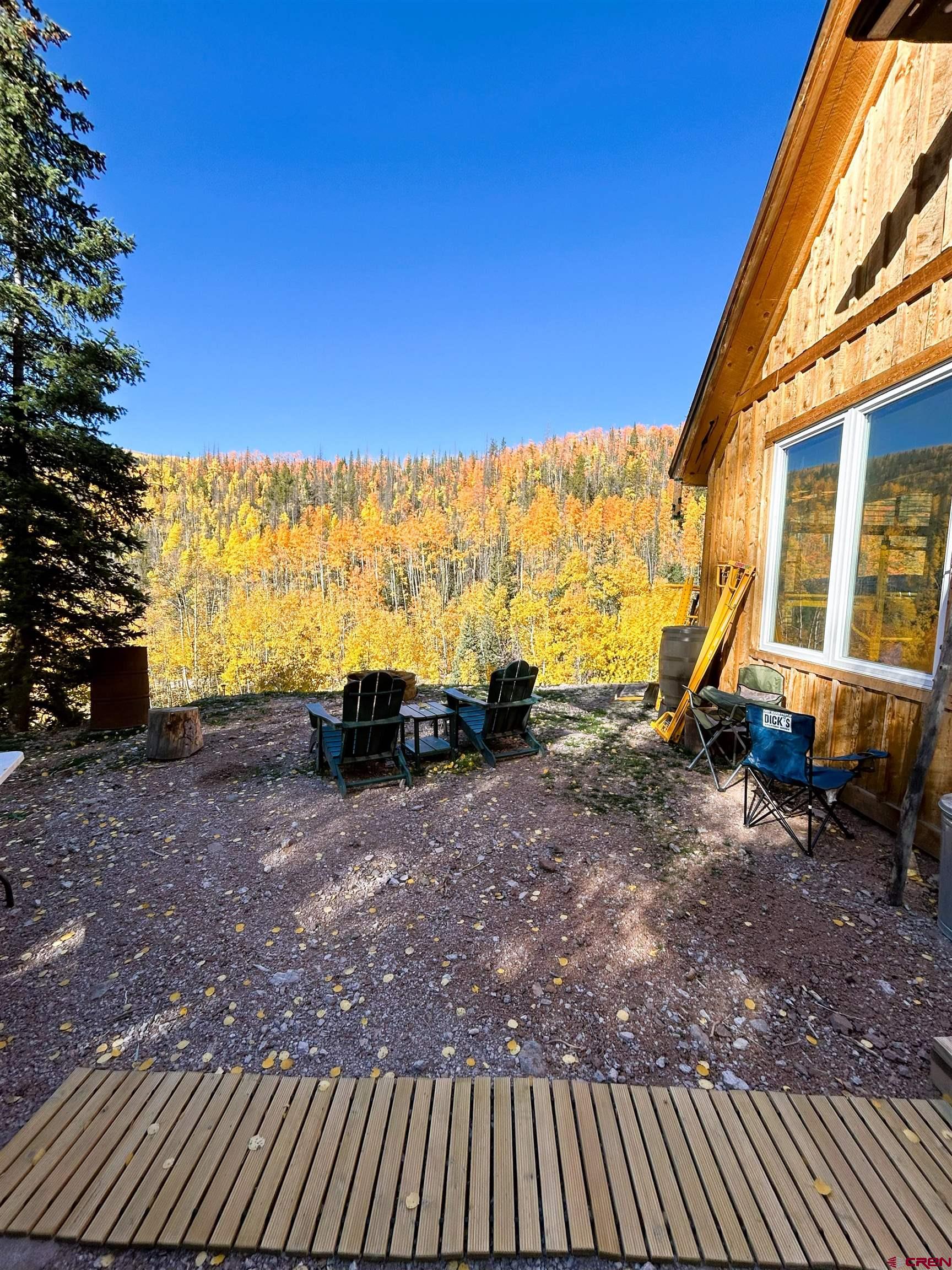 2540 Usfs Road Creede, CO 81130 - Photo 28 of 35 a view of a backyard with furniture and a garden