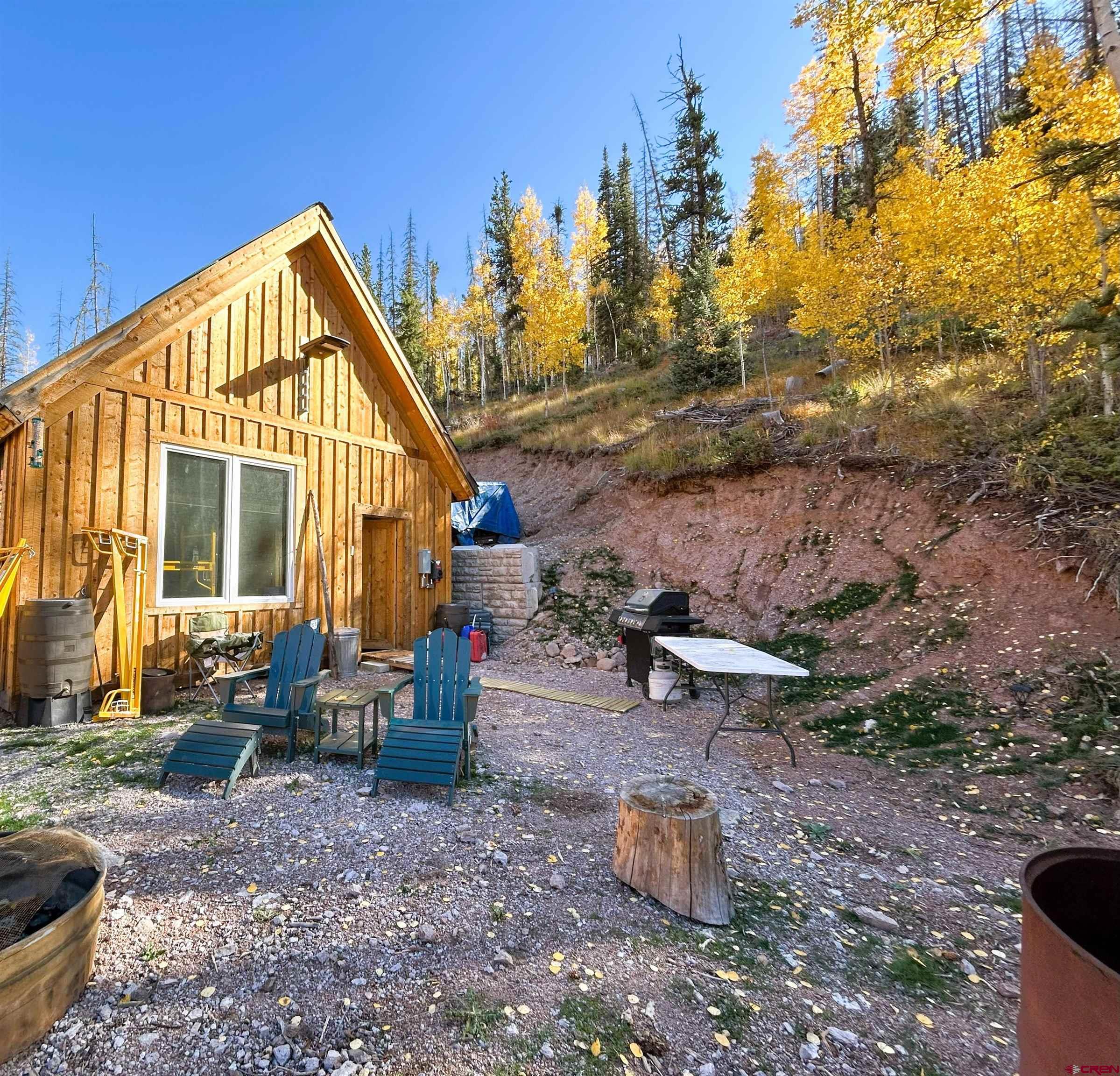 2540 Usfs Road Creede, CO 81130 - Photo 32 of 35 a view of a house with backyard and sitting area