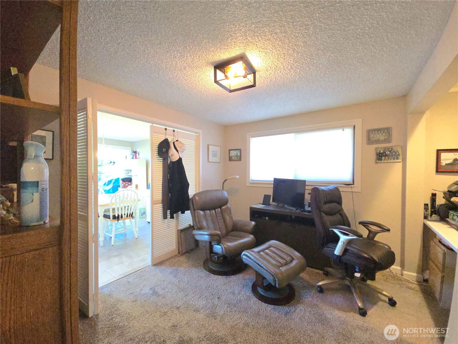 296 Taylor Boulevard Sequim, WA 98382 - Photo 11 of 29 a living room with furniture and a flat screen tv