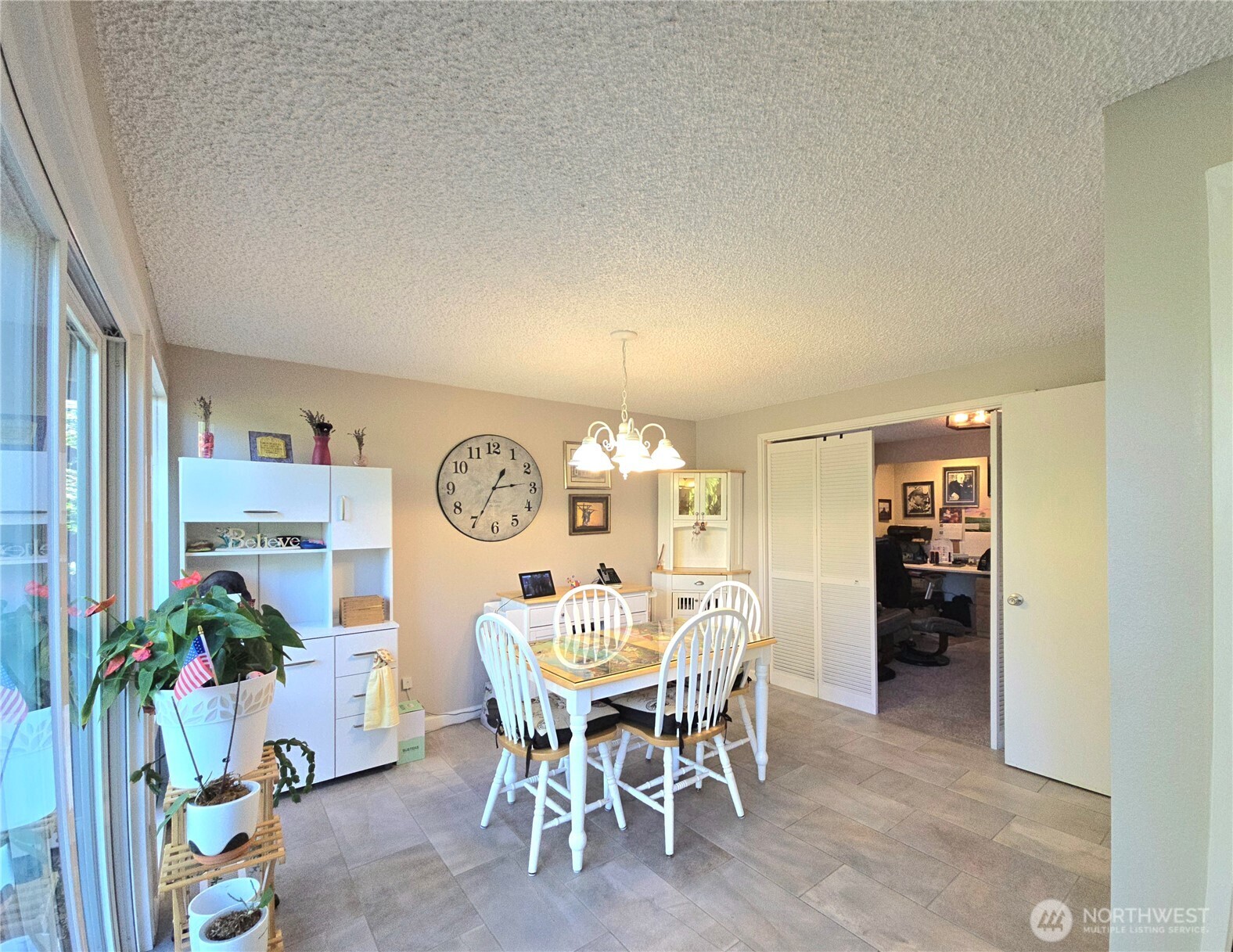 296 Taylor Boulevard Sequim, WA 98382 - Photo 13 of 29 a view of a dining room with furniture and chandelier