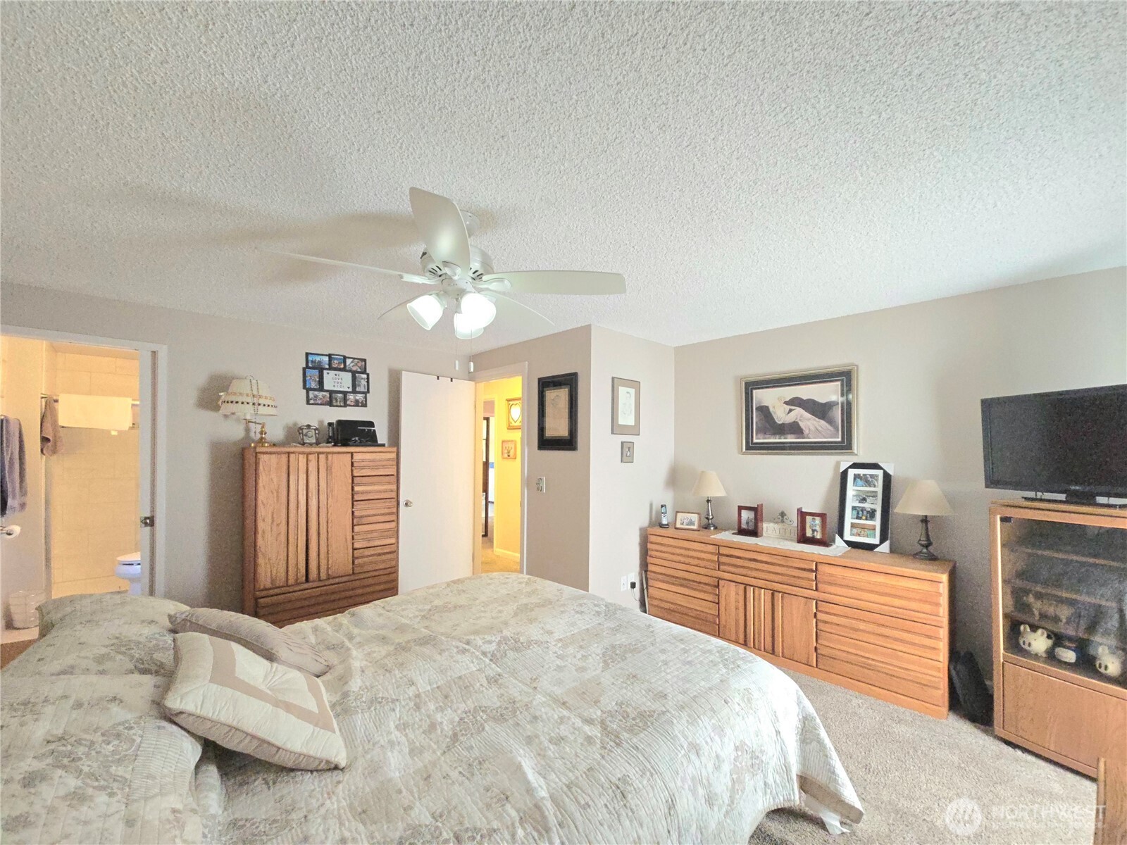 296 Taylor Boulevard Sequim, WA 98382 - Photo 19 of 29 a bedroom with a bed and a flat screen tv