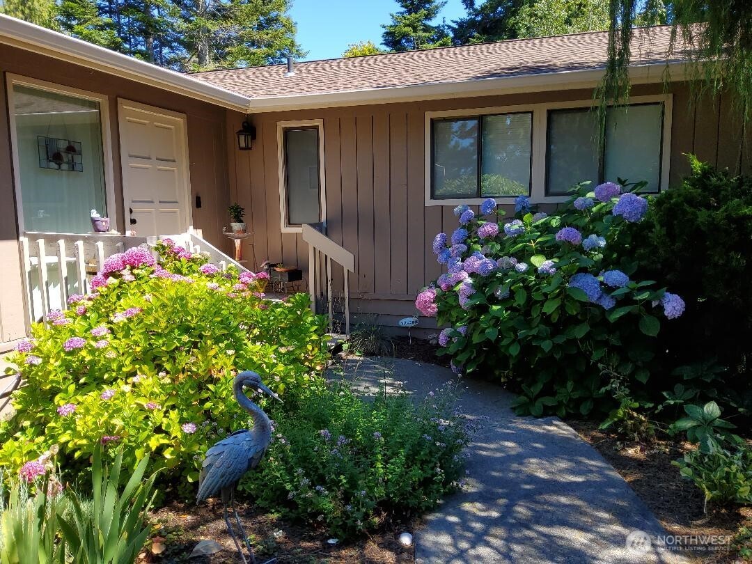 296 Taylor Boulevard Sequim, WA 98382 - Photo 2 of 29 a front view of a house with a yard