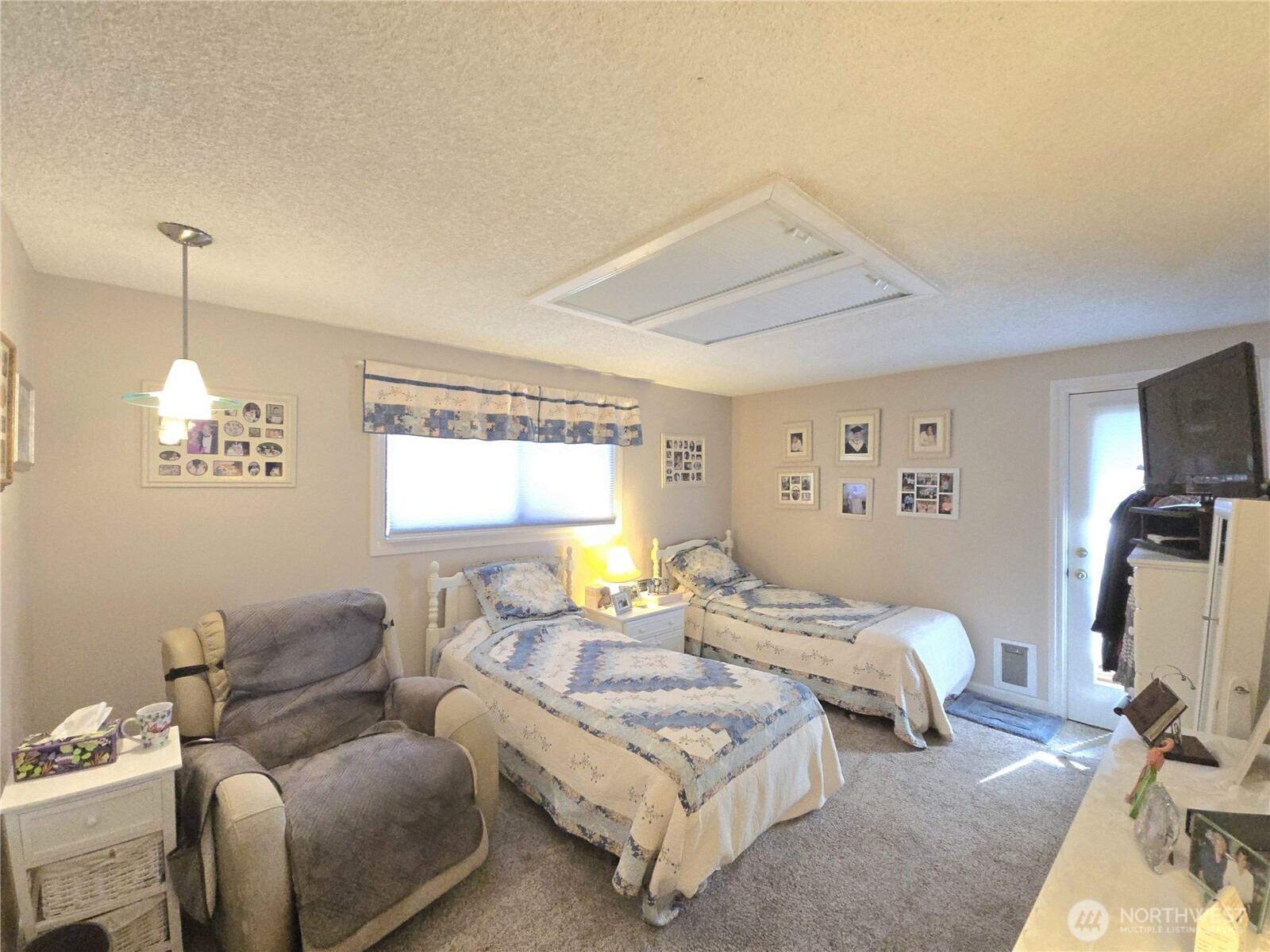 296 Taylor Boulevard Sequim, WA 98382 - Photo 21 of 29 a bedroom with furniture and a window