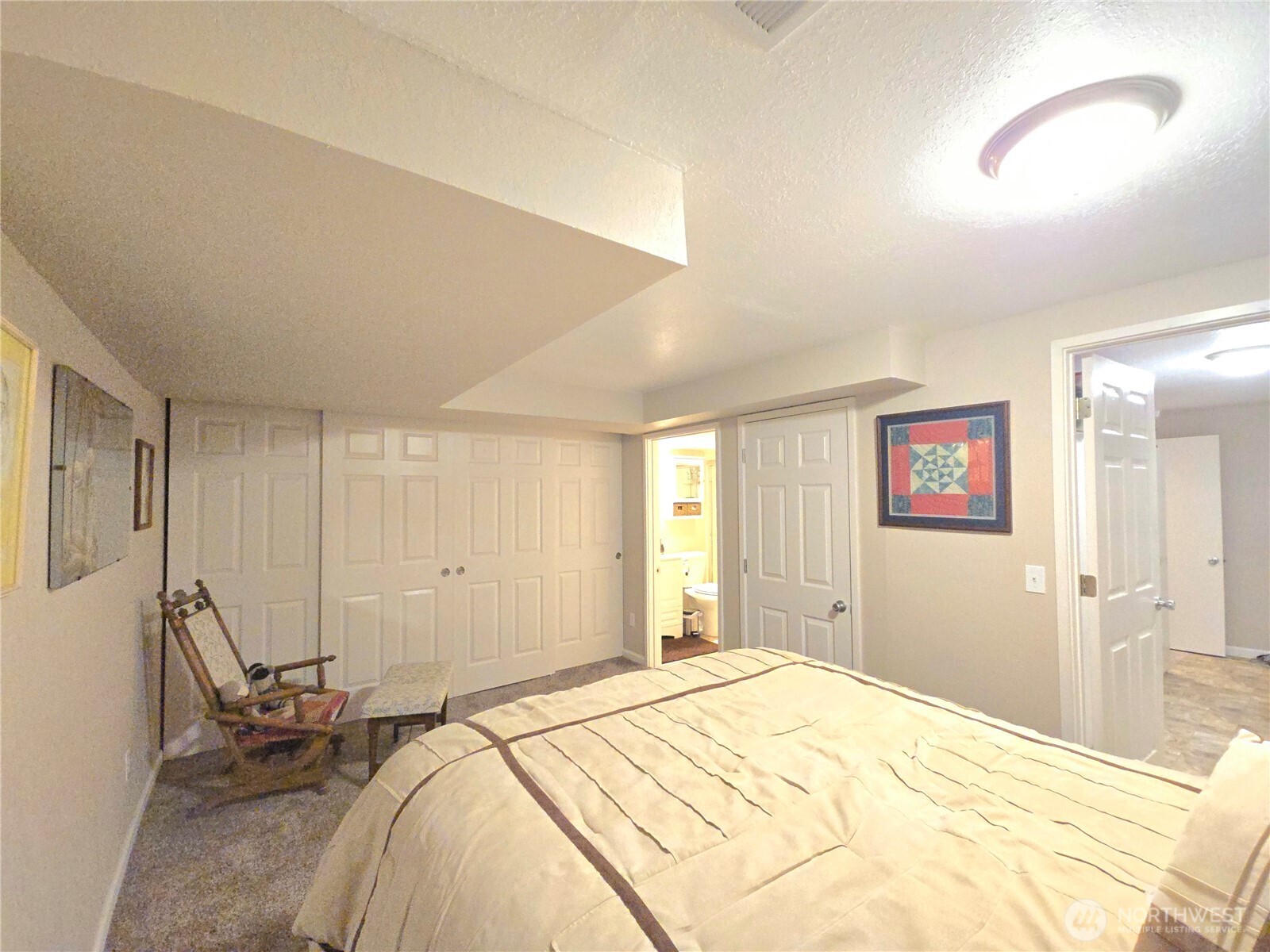 296 Taylor Boulevard Sequim, WA 98382 - Photo 22 of 29 a bedroom with a bed and a window