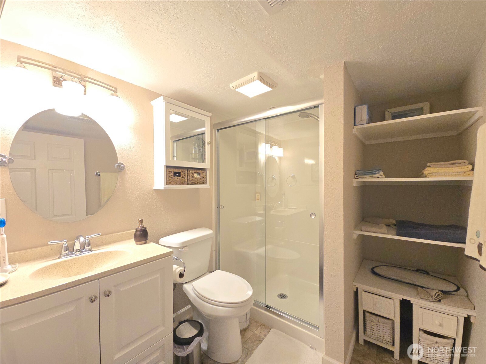 296 Taylor Boulevard Sequim, WA 98382 - Photo 25 of 29 a bathroom with a sink a toilet and shower