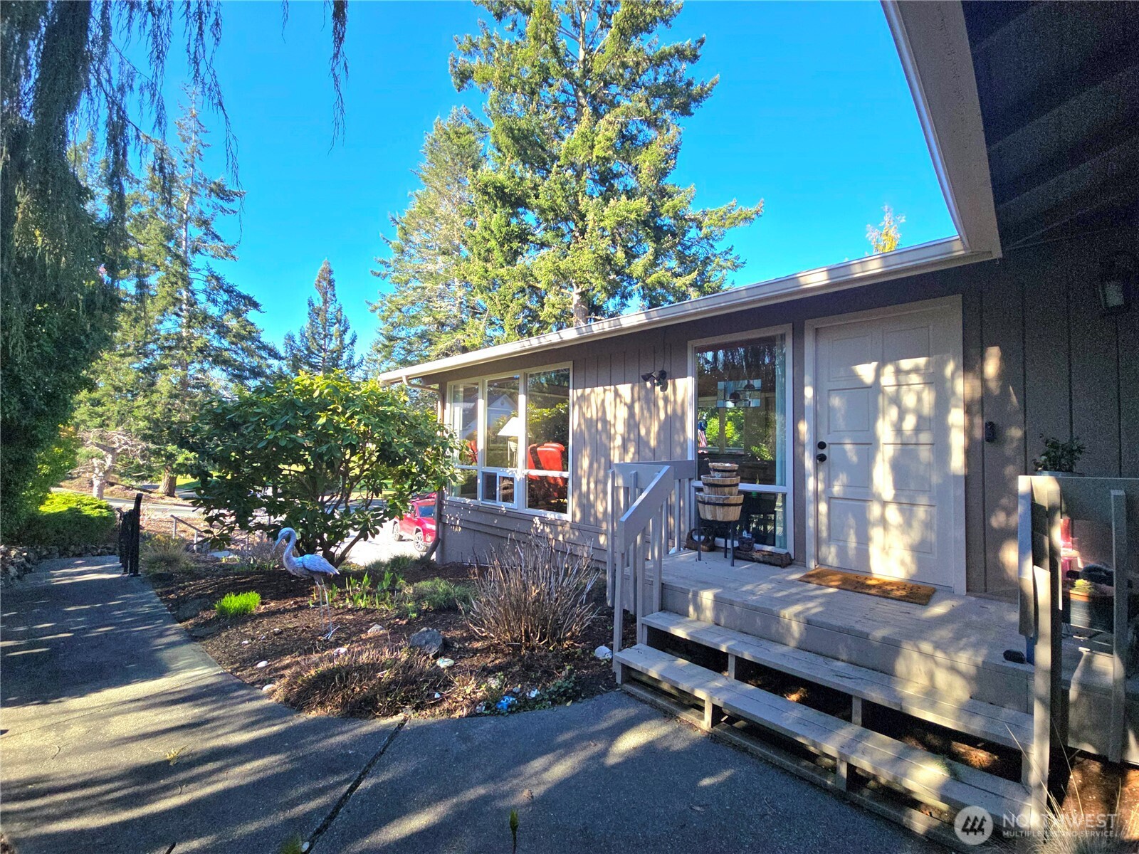 296 Taylor Boulevard Sequim, WA 98382 - Photo 28 of 29 a view of a house with backyard and sitting area