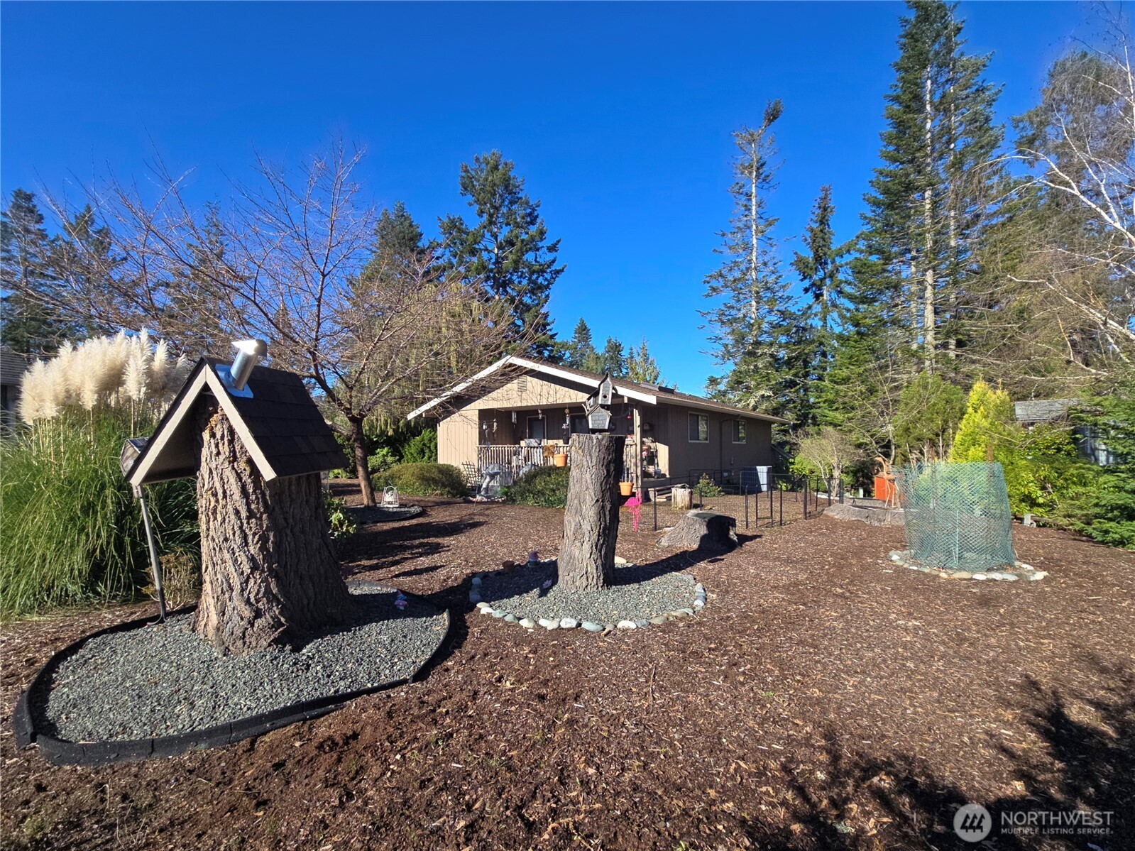 296 Taylor Boulevard Sequim, WA 98382 - Photo 4 of 29 a view of a house with a patio
