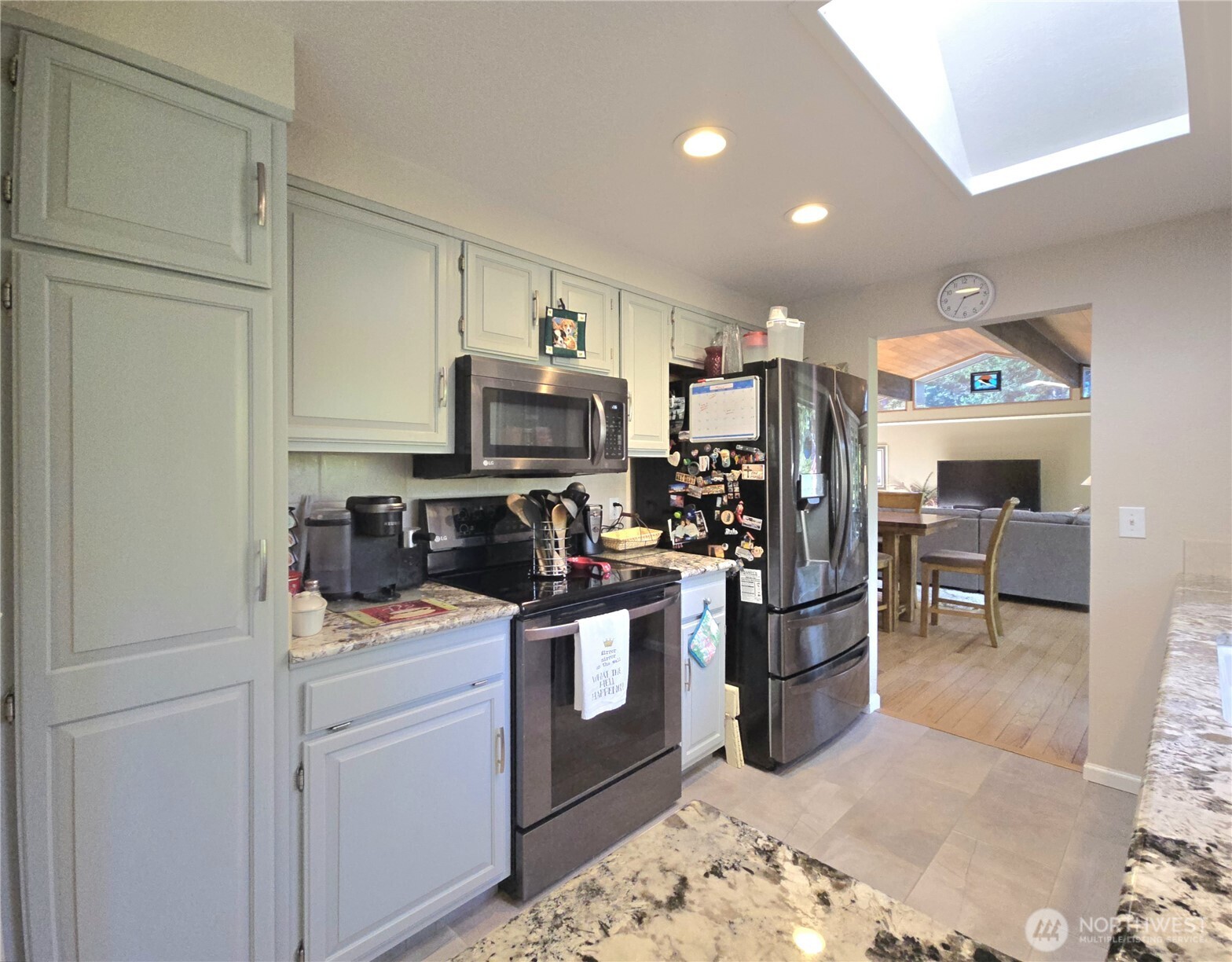 296 Taylor Boulevard Sequim, WA 98382 - Photo 9 of 29 a kitchen with a sink stainless steel appliances and cabinets