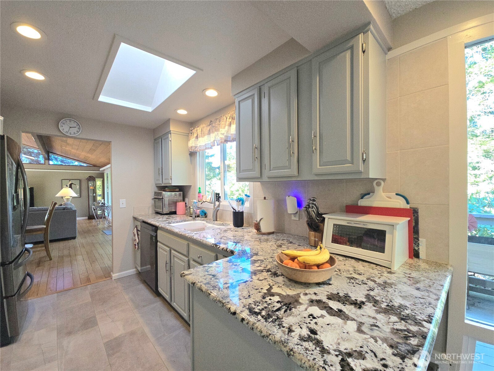 296 Taylor Boulevard Sequim, WA 98382 - Photo 10 of 29 a kitchen with a stove and cabinets